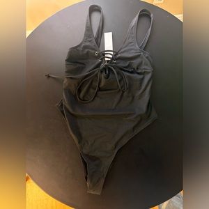 Brand new black one piece bathing suit.